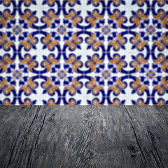 Image showing Wood table top and blur vintage ceramic tile pattern wall