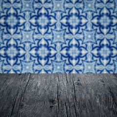 Image showing Wood table top and blur vintage ceramic tile pattern wall