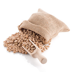 Image showing Uncooked chickpeas and wooden scoop