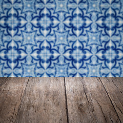 Image showing Wood table top and blur vintage ceramic tile pattern wall