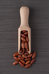 Image showing Wooden scoop with red beans