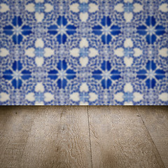 Image showing Wood table top and blur vintage ceramic tile pattern wall