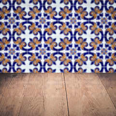 Image showing Wood table top and blur vintage ceramic tile pattern wall