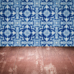 Image showing Wood table top and blur vintage ceramic tile pattern wall