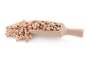 Image showing Uncooked chickpeas and wooden scoop