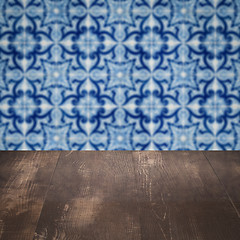 Image showing Wood table top and blur vintage ceramic tile pattern wall