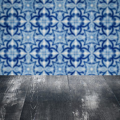 Image showing Wood table top and blur vintage ceramic tile pattern wall