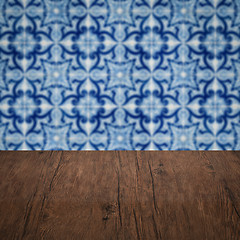 Image showing Wood table top and blur vintage ceramic tile pattern wall