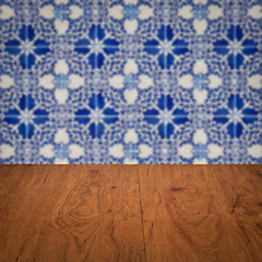 Image showing Wood table top and blur vintage ceramic tile pattern wall