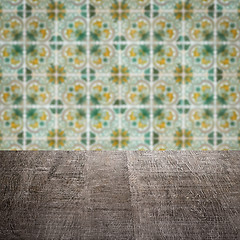 Image showing Wood table top and blur vintage ceramic tile pattern wall