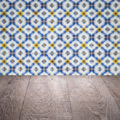 Image showing Wood table top and blur vintage ceramic tile pattern wall