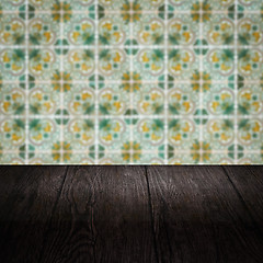 Image showing Wood table top and blur vintage ceramic tile pattern wall