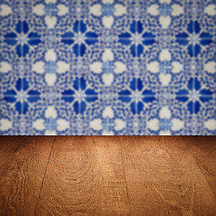 Image showing Wood table top and blur vintage ceramic tile pattern wall