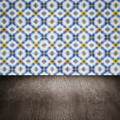 Image showing Wood table top and blur vintage ceramic tile pattern wall