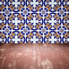 Image showing Wood table top and blur vintage ceramic tile pattern wall