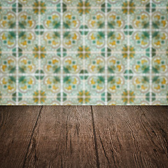 Image showing Wood table top and blur vintage ceramic tile pattern wall