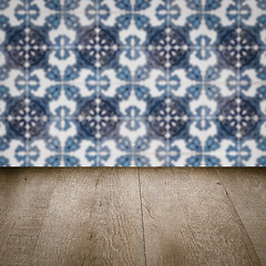 Image showing Wood table top and blur vintage ceramic tile pattern wall