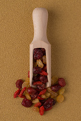 Image showing Wooden scoop with mixed dried fruits