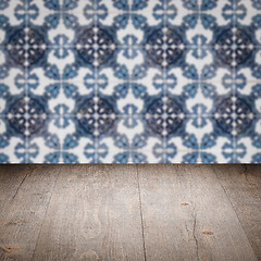 Image showing Wood table top and blur vintage ceramic tile pattern wall