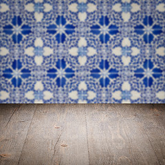 Image showing Wood table top and blur vintage ceramic tile pattern wall