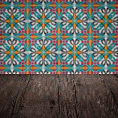 Image showing Wood table top and blur vintage ceramic tile pattern wall