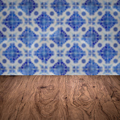 Image showing Wood table top and blur vintage ceramic tile pattern wall