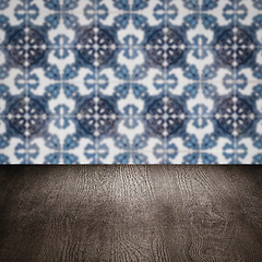 Image showing Wood table top and blur vintage ceramic tile pattern wall