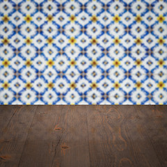 Image showing Wood table top and blur vintage ceramic tile pattern wall