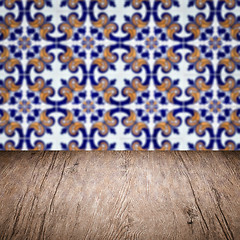 Image showing Wood table top and blur vintage ceramic tile pattern wall