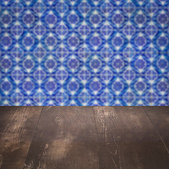 Image showing Wood table top and blur vintage ceramic tile pattern wall