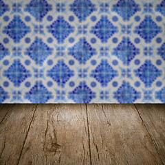 Image showing Wood table top and blur vintage ceramic tile pattern wall