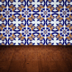 Image showing Wood table top and blur vintage ceramic tile pattern wall