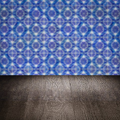 Image showing Wood table top and blur vintage ceramic tile pattern wall