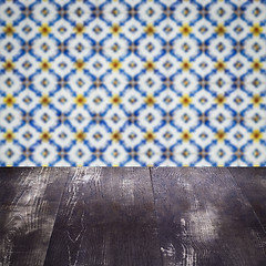 Image showing Wood table top and blur vintage ceramic tile pattern wall