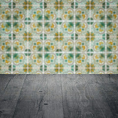 Image showing Wood table top and blur vintage ceramic tile pattern wall