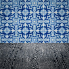 Image showing Wood table top and blur vintage ceramic tile pattern wall