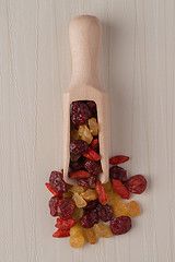 Image showing Wooden scoop with mixed dried fruits