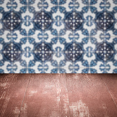 Image showing Wood table top and blur vintage ceramic tile pattern wall