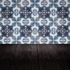 Image showing Wood table top and blur vintage ceramic tile pattern wall