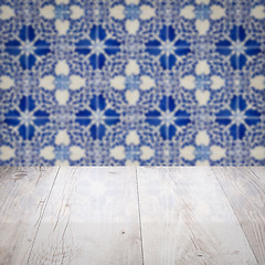 Image showing Wood table top and blur vintage ceramic tile pattern wall