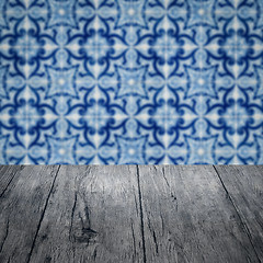 Image showing Wood table top and blur vintage ceramic tile pattern wall