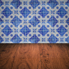 Image showing Wood table top and blur vintage ceramic tile pattern wall