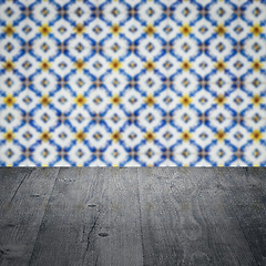 Image showing Wood table top and blur vintage ceramic tile pattern wall