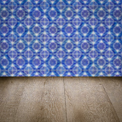 Image showing Wood table top and blur vintage ceramic tile pattern wall