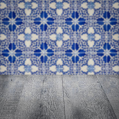 Image showing Wood table top and blur vintage ceramic tile pattern wall