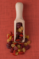 Image showing Wooden scoop with mixed dried fruits