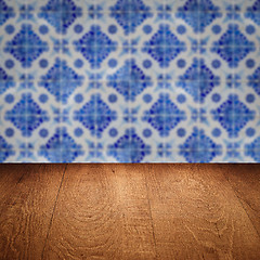 Image showing Wood table top and blur vintage ceramic tile pattern wall