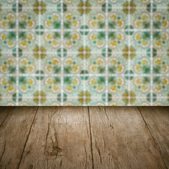 Image showing Wood table top and blur vintage ceramic tile pattern wall