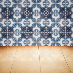 Image showing Wood table top and blur vintage ceramic tile pattern wall