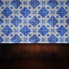 Image showing Wood table top and blur vintage ceramic tile pattern wall